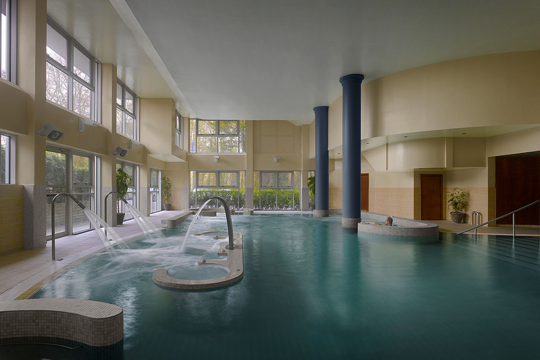 spacious and bright pool with water fountains
